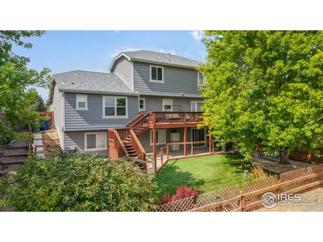 a bathroom with a sink shower and a mirror