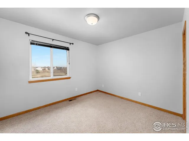 a aerial view of a house with swimming pool garden and patio