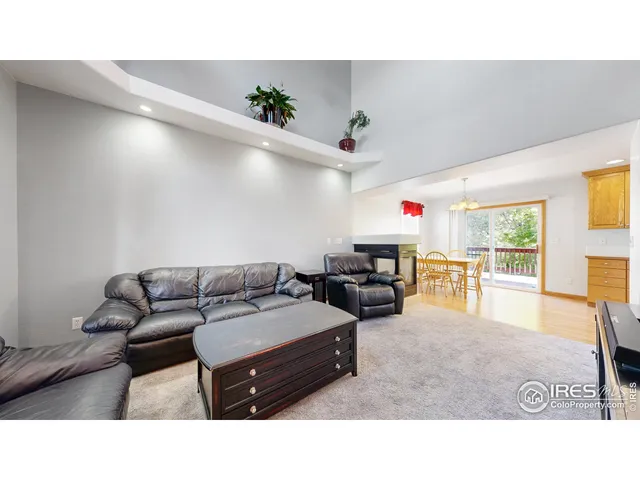 a open hall with a fireplace and cabinet