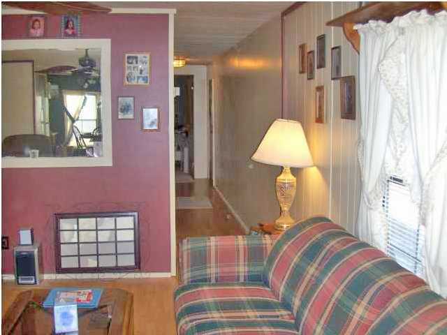 3537 Richardson Road Crestview, FL 32539 - Photo 1 of 29 a bedroom with a bed and a chandelier