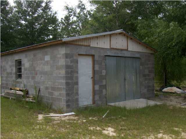 3537 Richardson Road Crestview, FL 32539 - Photo 15 of 29 a backyard of a house with swimming pool