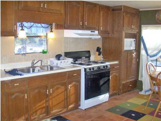 3537 Richardson Road Crestview, FL 32539 - Photo 4 of 29 a kitchen with stainless steel appliances granite countertop a stove a sink and a refrigerator