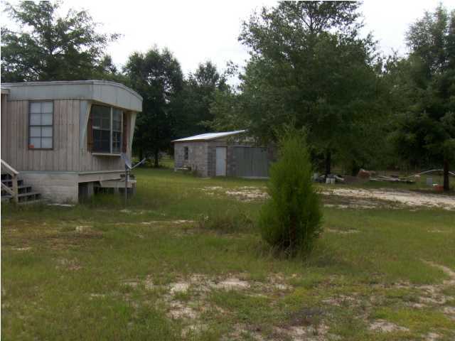 3537 Richardson Road Crestview, FL 32539 - Photo 10 of 29 a view of a backyard with swimming pool
