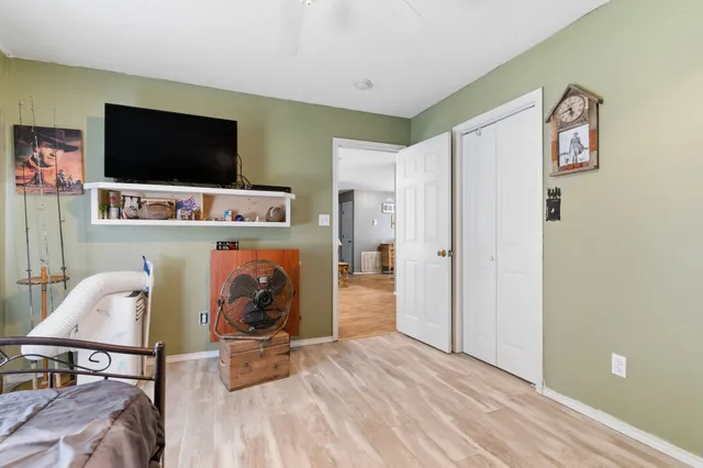 a view of workspace with wooden floor windows