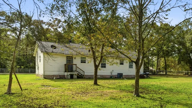 a view of backyard with a garden and entertaining space