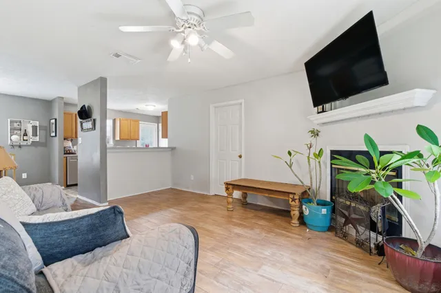 a bedroom with furniture and a flat screen tv