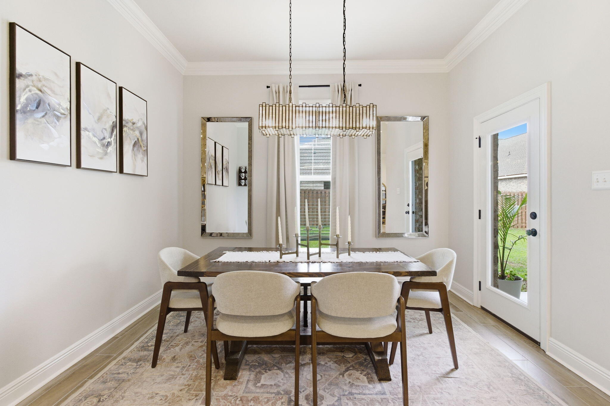 140 Flora Lane Freeport, FL 32439 - Photo 17 of 77 a view of a dining room with furniture window and wooden floor