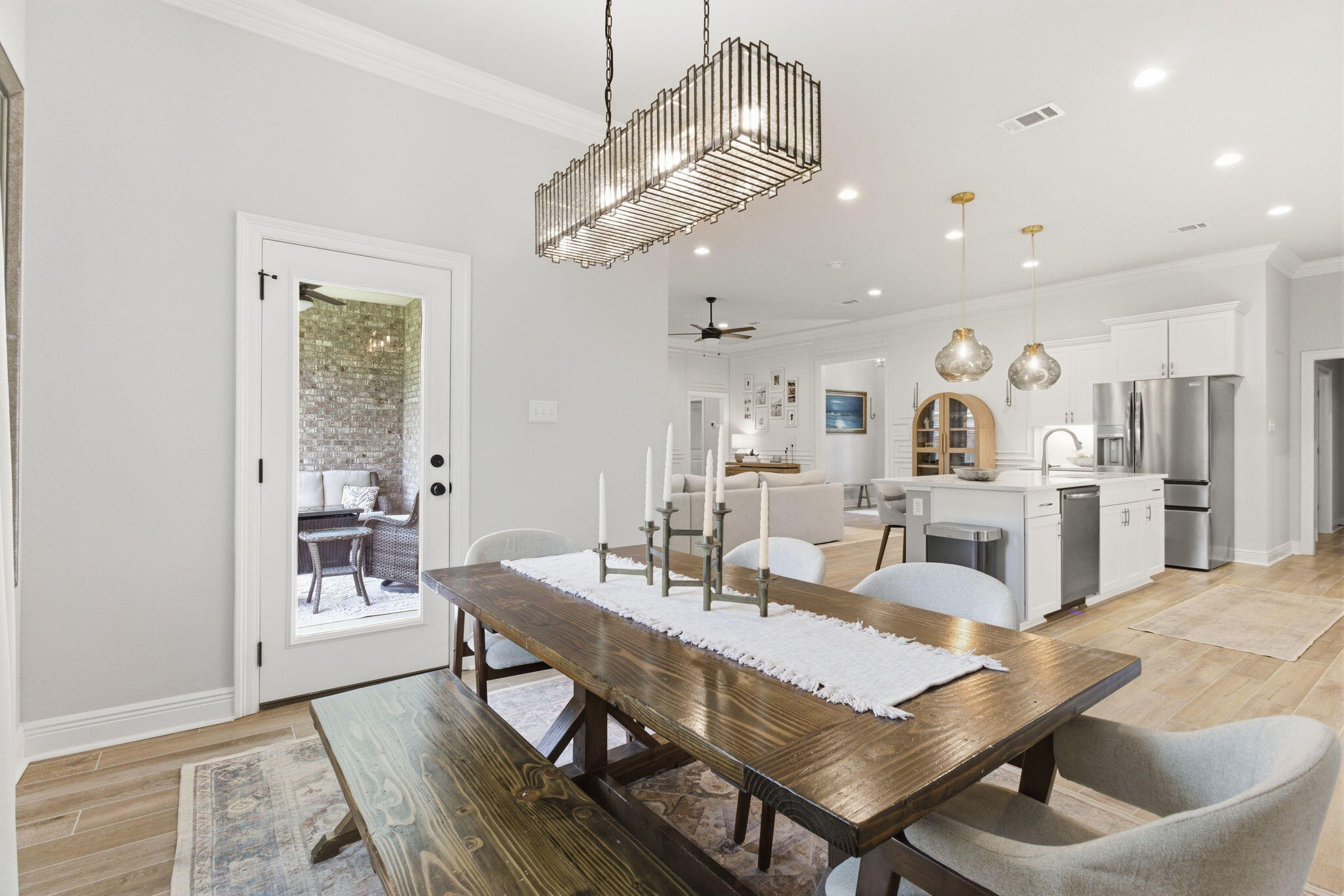 140 Flora Lane Freeport, FL 32439 - Photo 18 of 77 a view of a dining room with furniture and wooden floor
