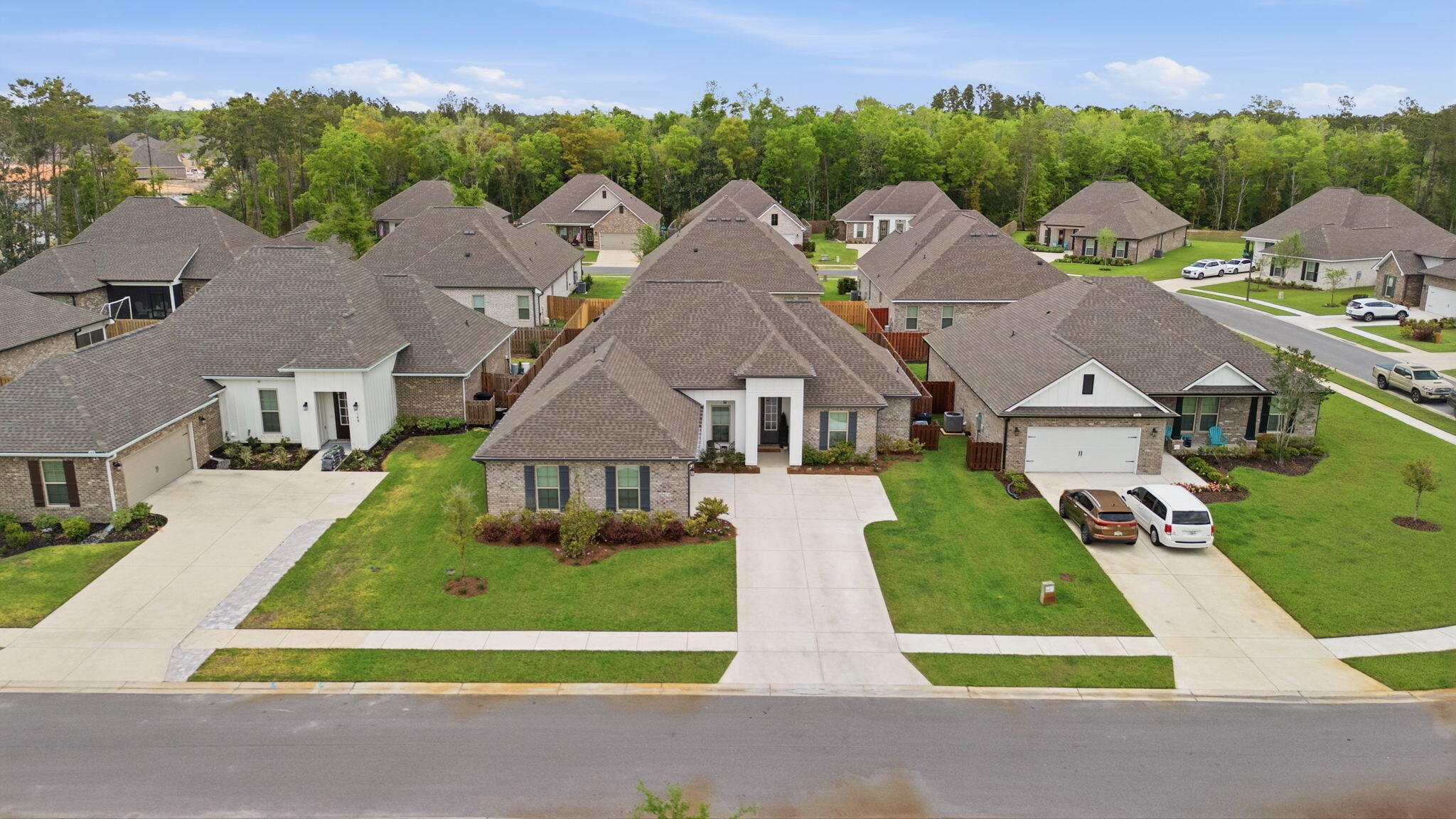 140 Flora Lane Freeport, FL 32439 - Photo 2 of 77 an aerial view of multiple houses with a yard