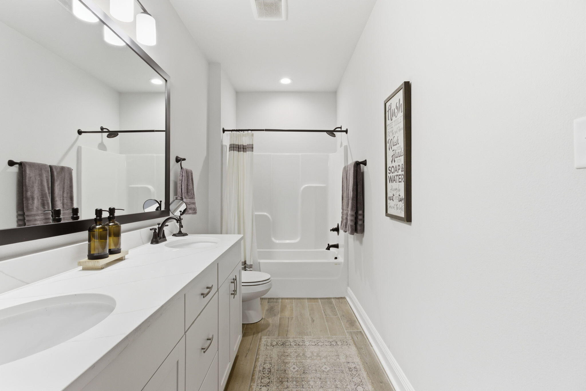 140 Flora Lane Freeport, FL 32439 - Photo 21 of 77 a bathroom with a double vanity sink mirror double and shower