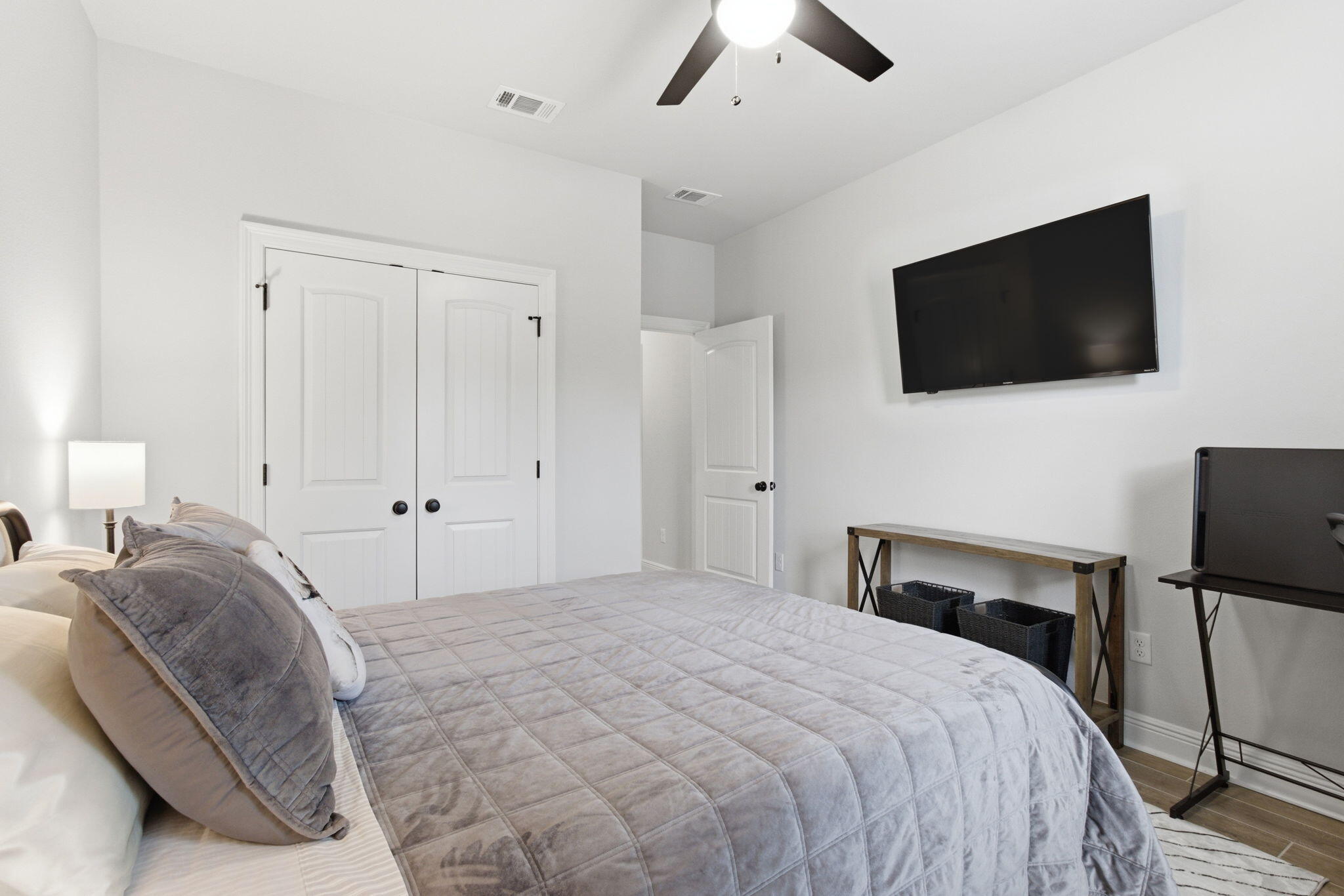 140 Flora Lane Freeport, FL 32439 - Photo 23 of 77 a bedroom with a bed and a flat screen tv