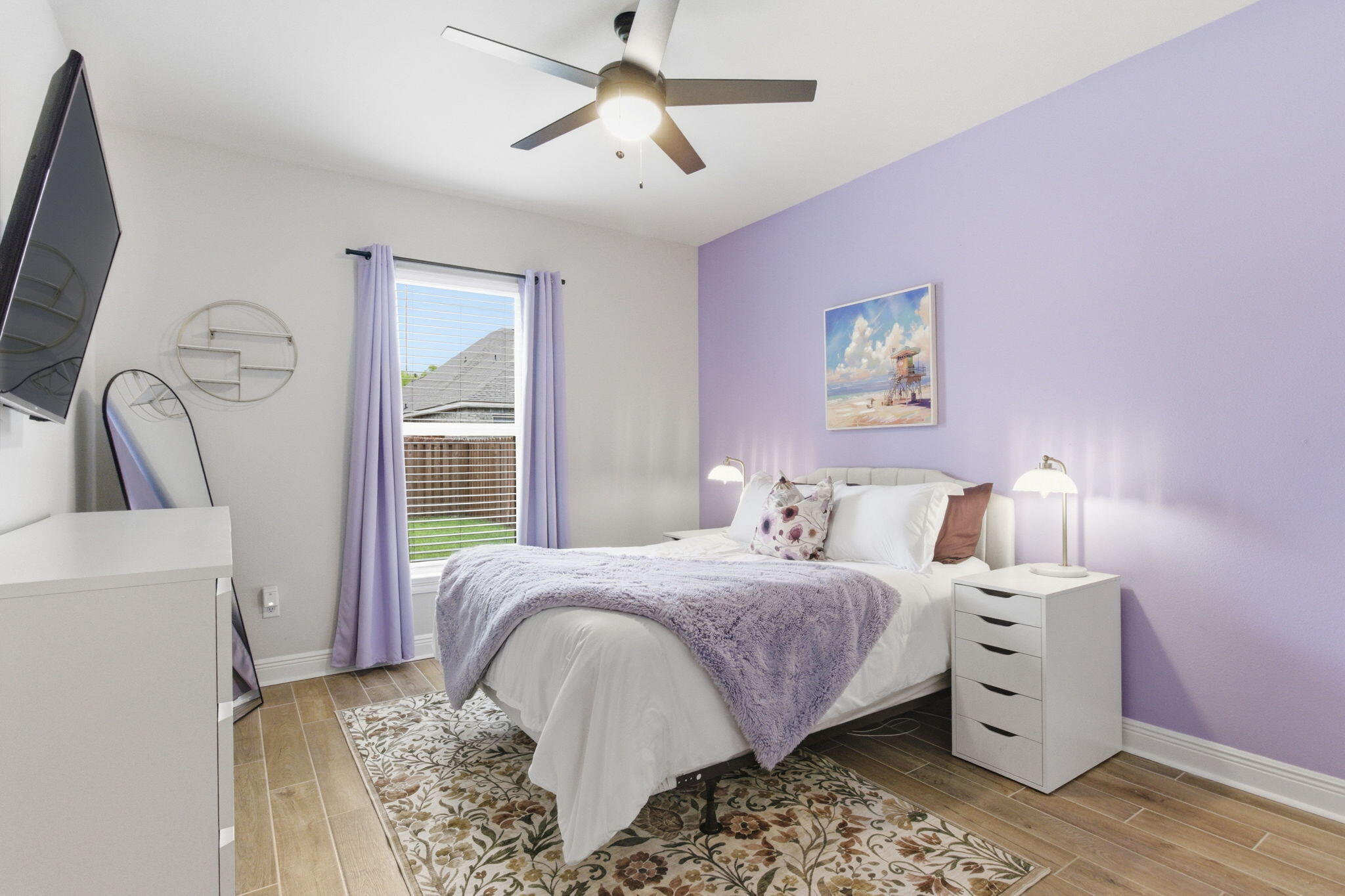 140 Flora Lane Freeport, FL 32439 - Photo 24 of 77 a bedroom with a large bed and a chandelier