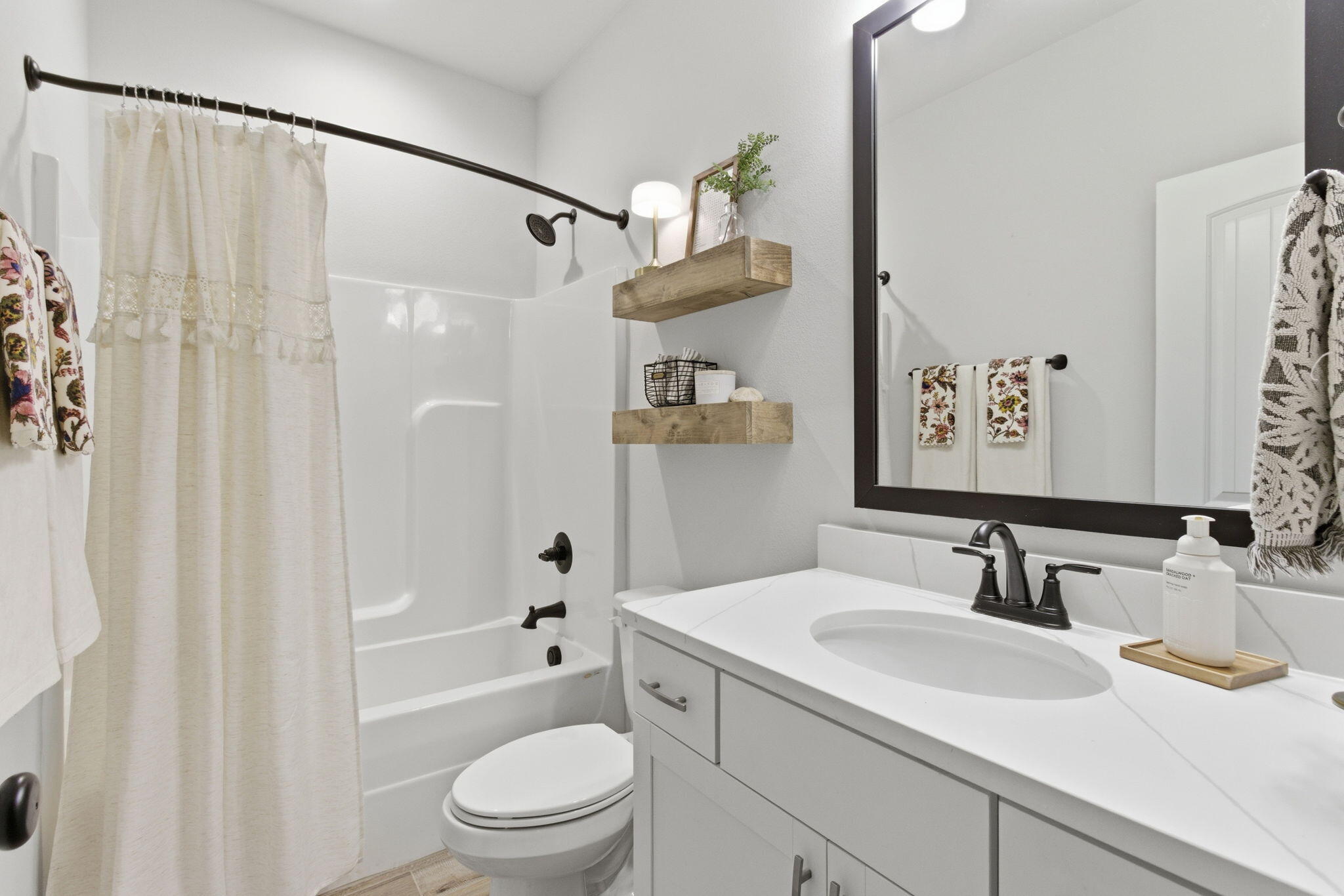 140 Flora Lane Freeport, FL 32439 - Photo 26 of 77 a bathroom with a sink a toilet and shower