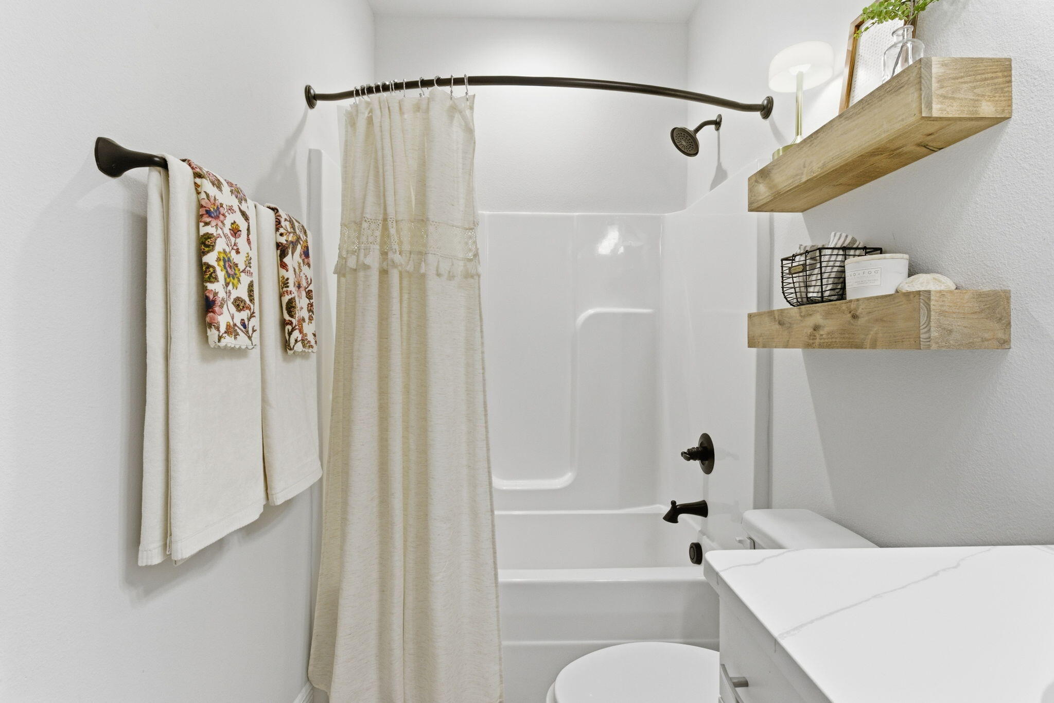 140 Flora Lane Freeport, FL 32439 - Photo 27 of 77 a bathroom with a shower curtain and a shower curtain