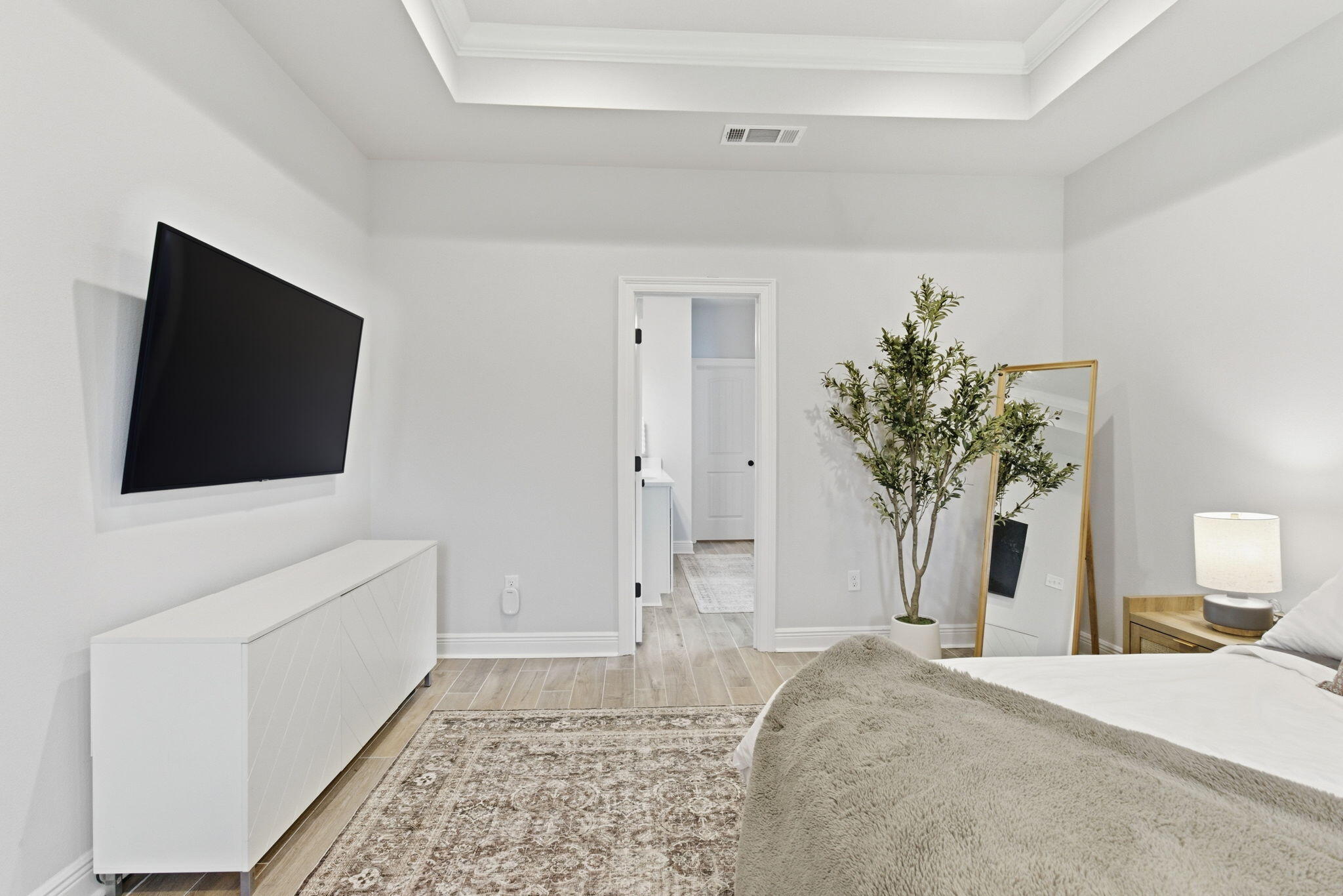 140 Flora Lane Freeport, FL 32439 - Photo 30 of 77 a bedroom with a bed and a flat screen tv