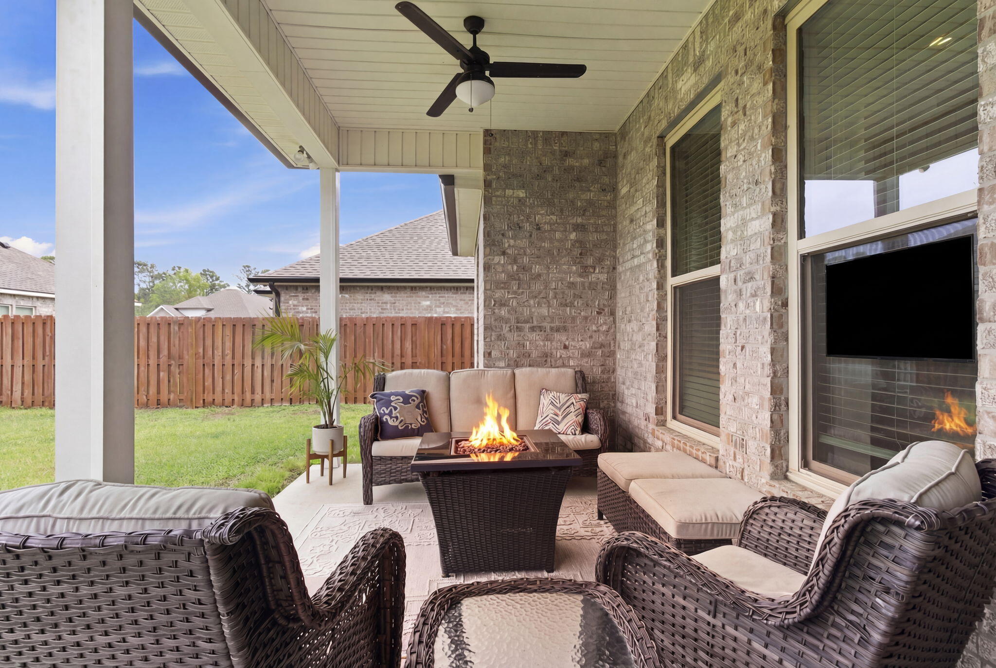 140 Flora Lane Freeport, FL 32439 - Photo 42 of 77 a outdoor living space with furniture and a fireplace