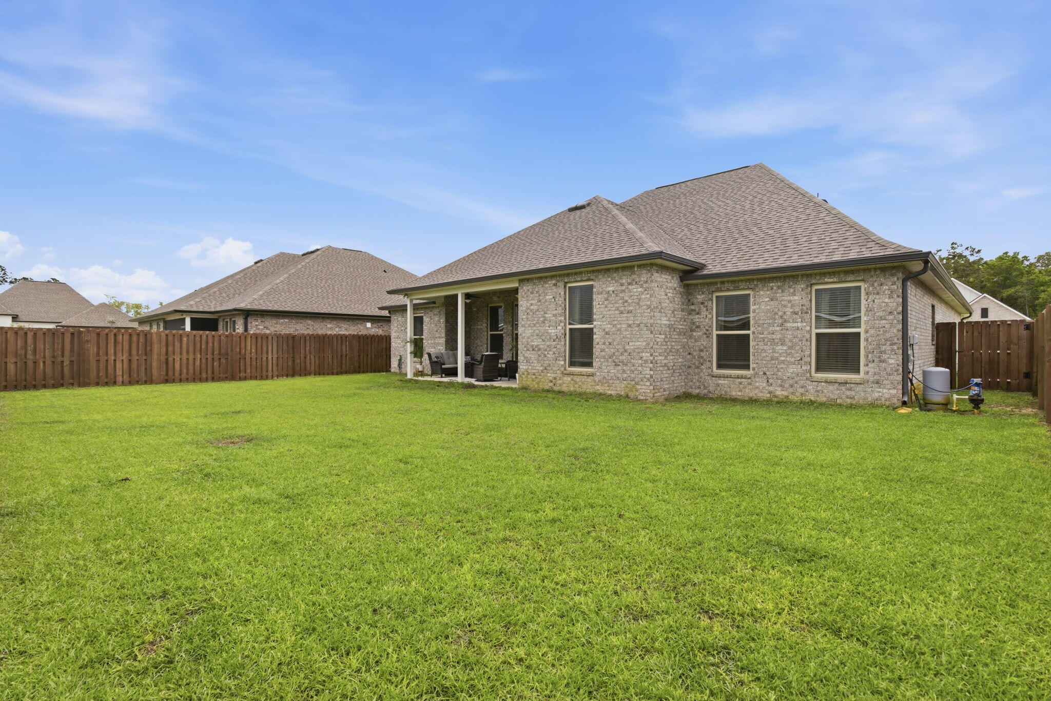 140 Flora Lane Freeport, FL 32439 - Photo 45 of 77 a front view of house with yard and green space