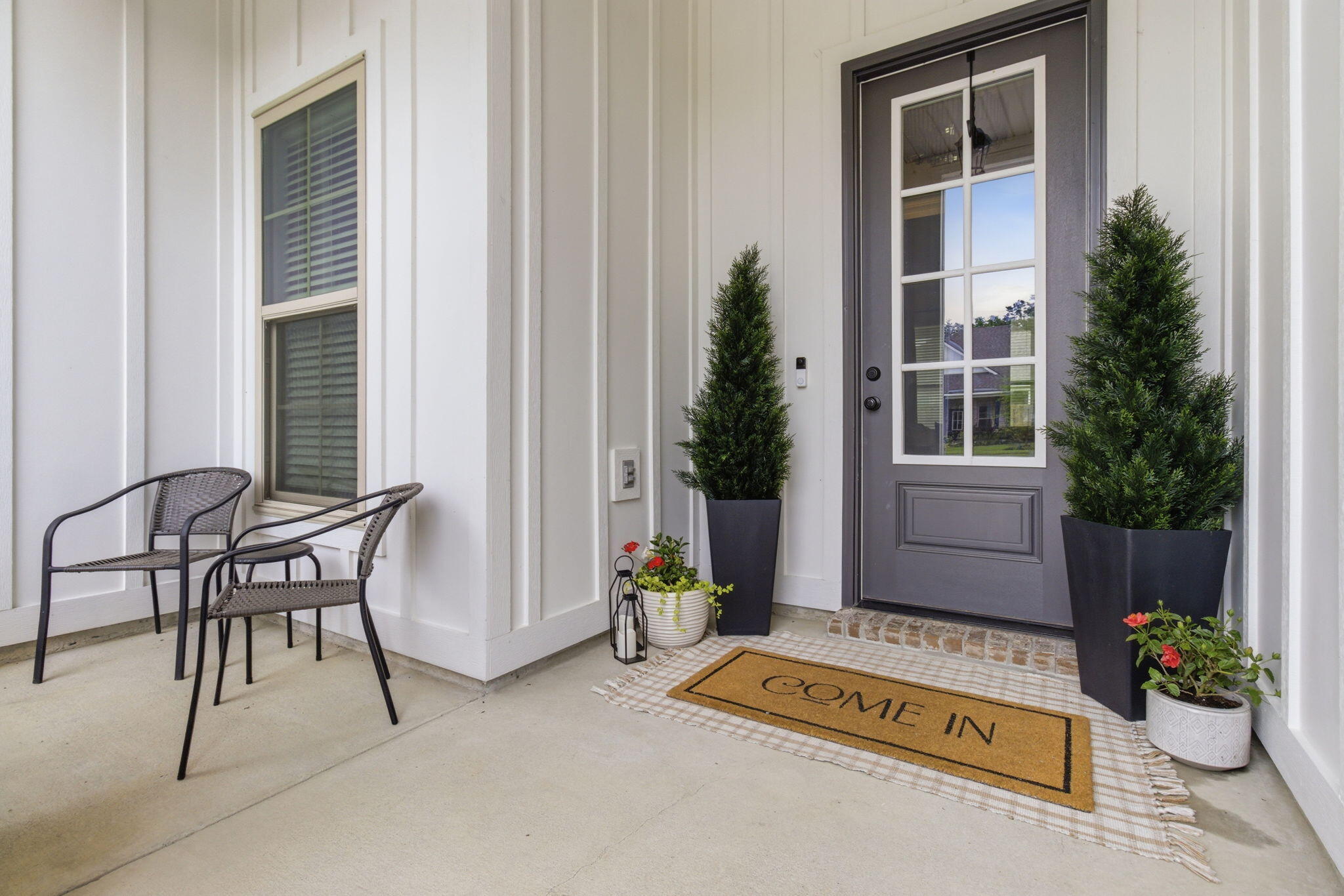 140 Flora Lane Freeport, FL 32439 - Photo 5 of 77 a building outdoor space with patio furniture and potted plants
