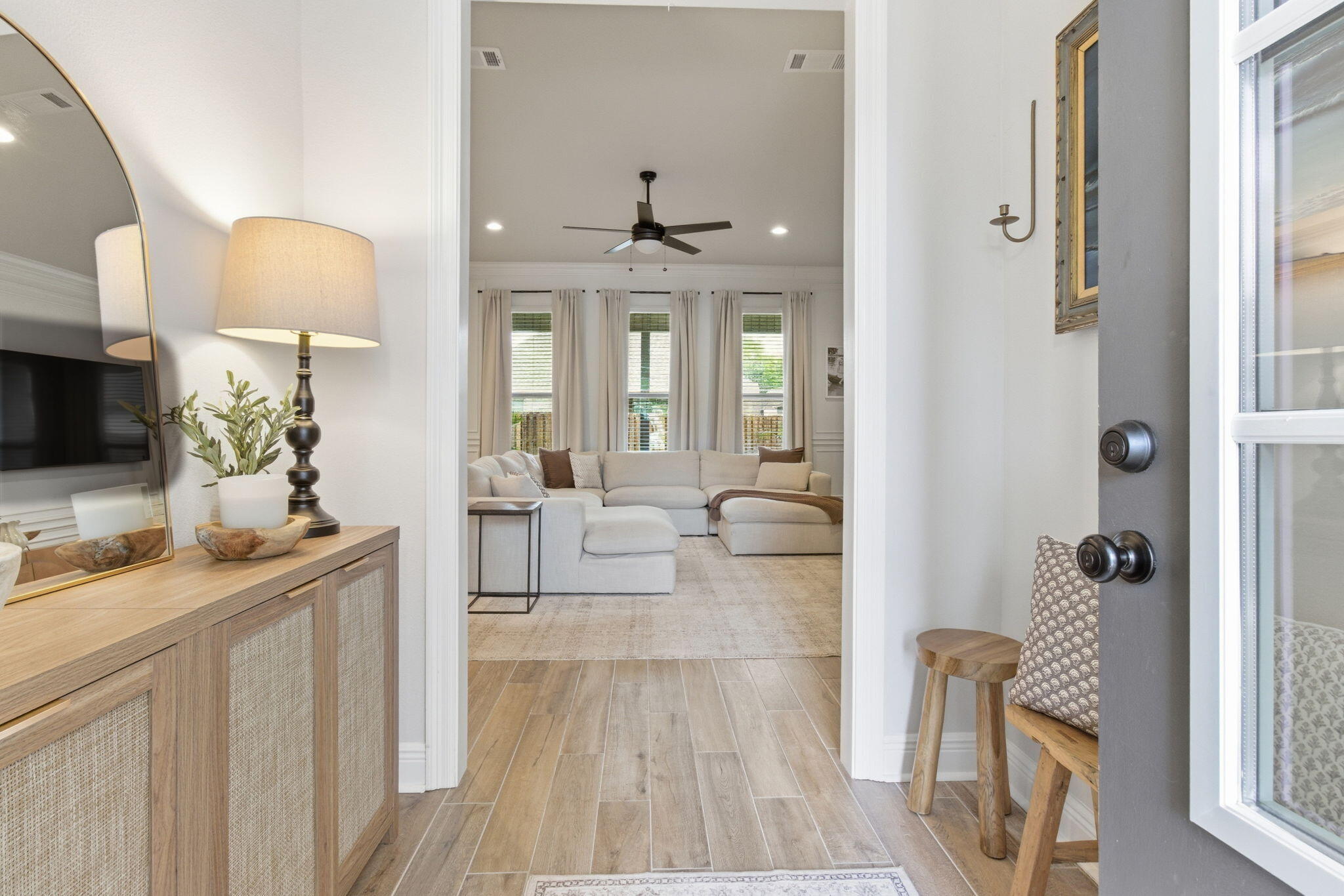 140 Flora Lane Freeport, FL 32439 - Photo 6 of 77 a living room with furniture a flat screen tv and a fireplace