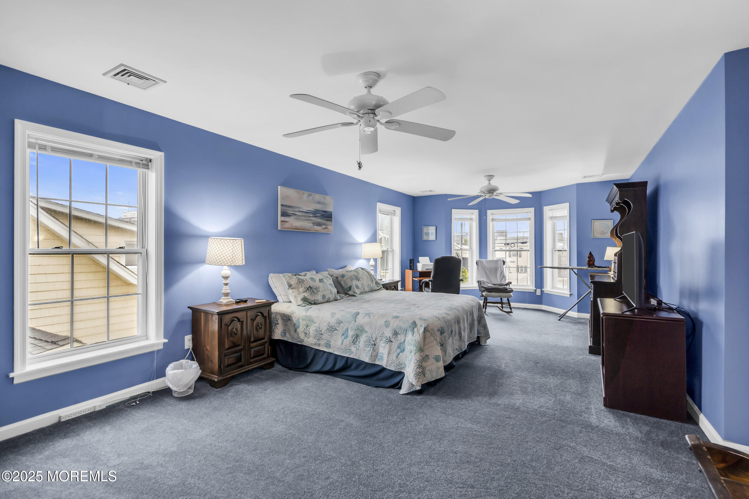 30 South Surf Road Lavallette, NJ 08735 - Photo 12 of 19 a spacious bedroom with a bed couch chandelier and a window