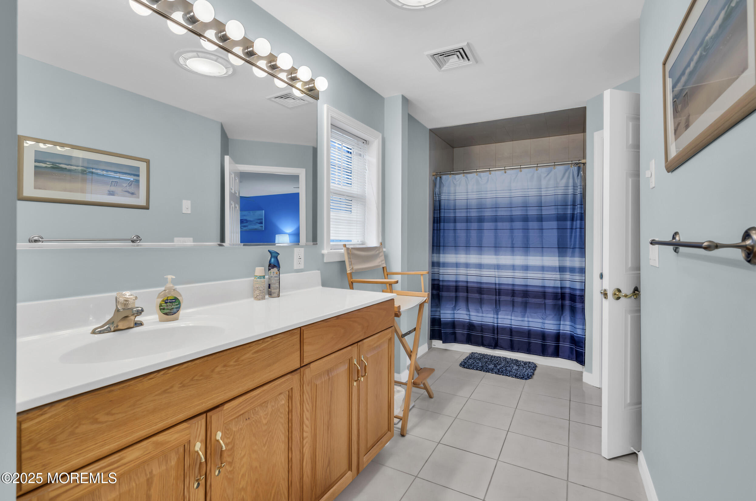 30 South Surf Road Lavallette, NJ 08735 - Photo 14 of 19 a bathroom with a sink double vanity and a mirror