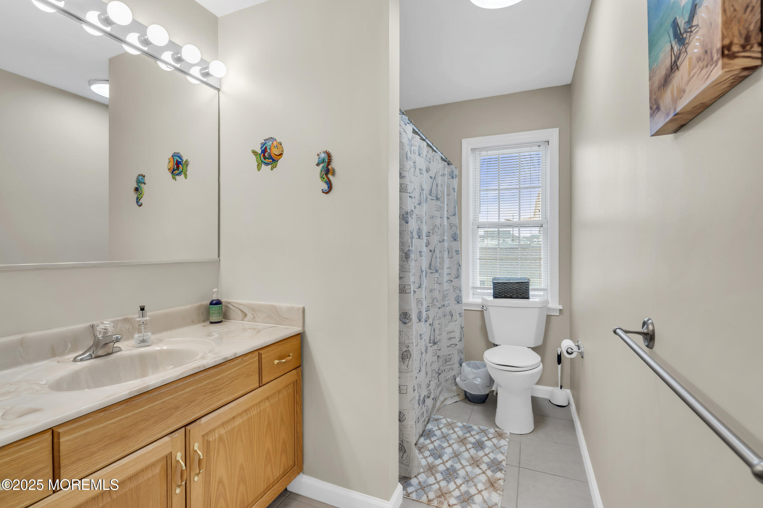30 South Surf Road Lavallette, NJ 08735 - Photo 15 of 19 a bathroom with a sink a toilet a large mirror and shower