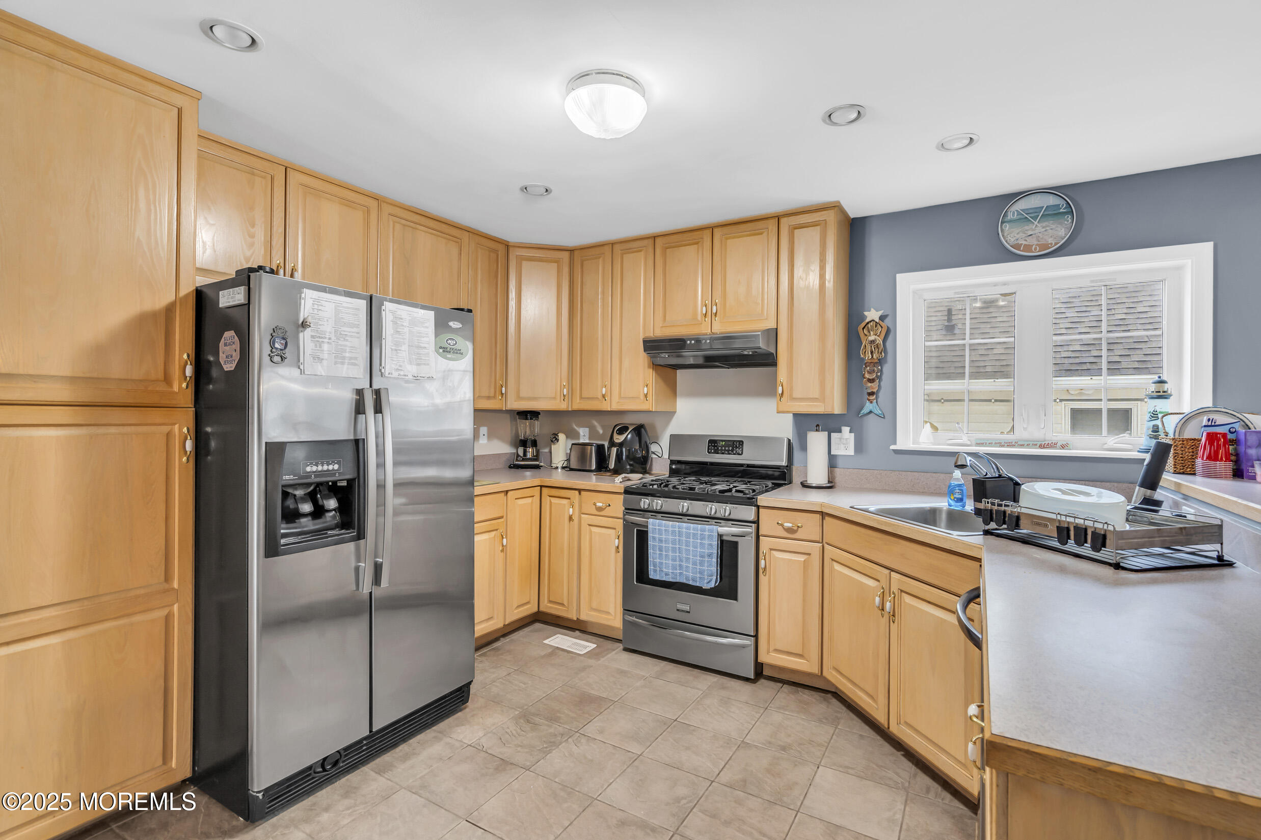 30 South Surf Road Lavallette, NJ 08735 - Photo 9 of 19 a kitchen with stainless steel appliances granite countertop a refrigerator sink and stove