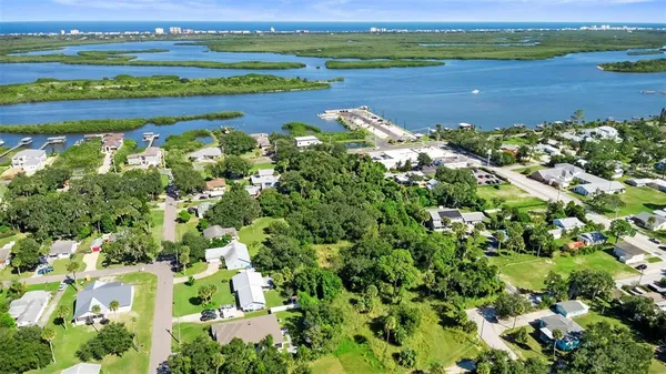 a view of a lake with a house in the background