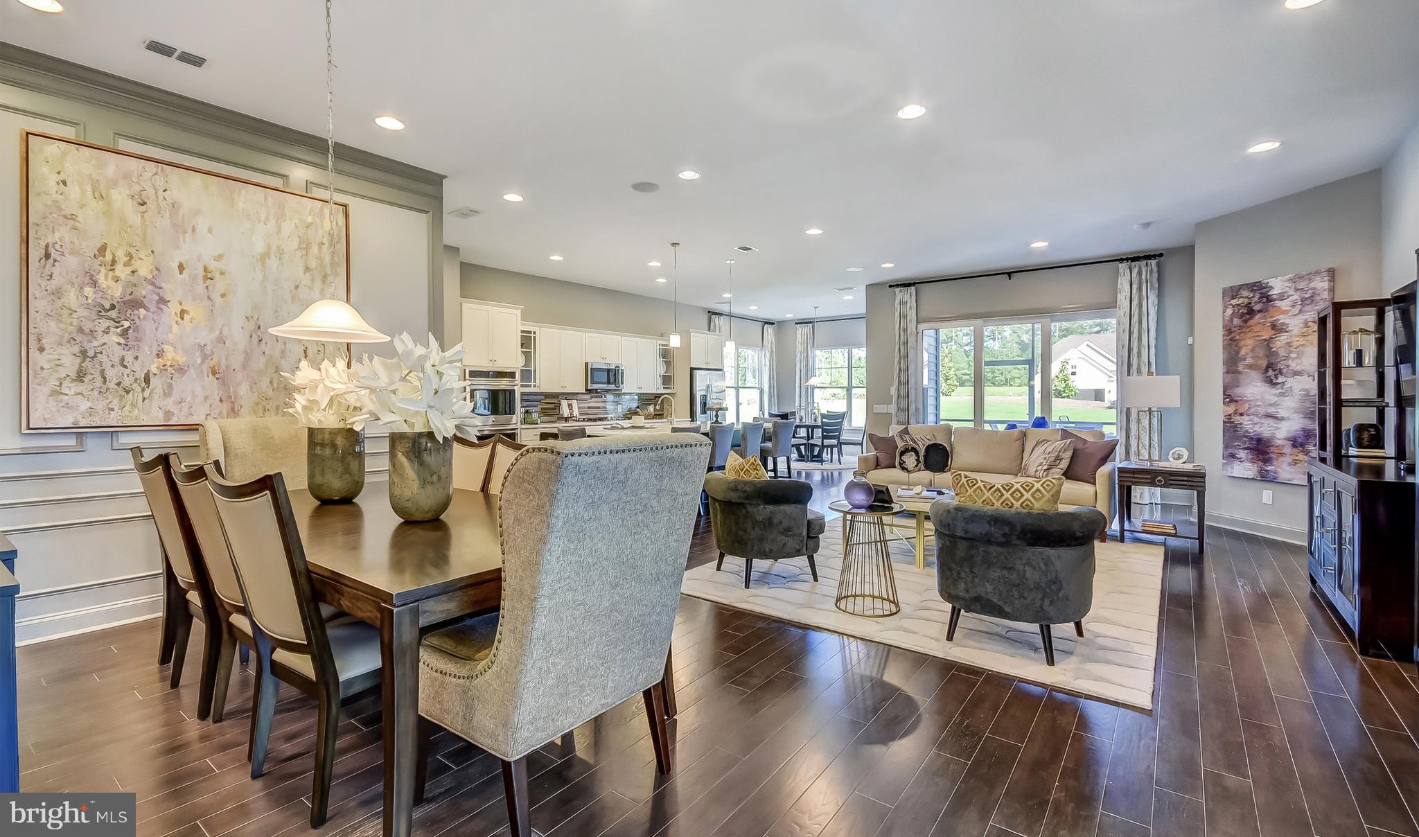19150 Chartres Street Lewes, DE 19958 - Photo 2 of 12 a living room with furniture dining table and a large window