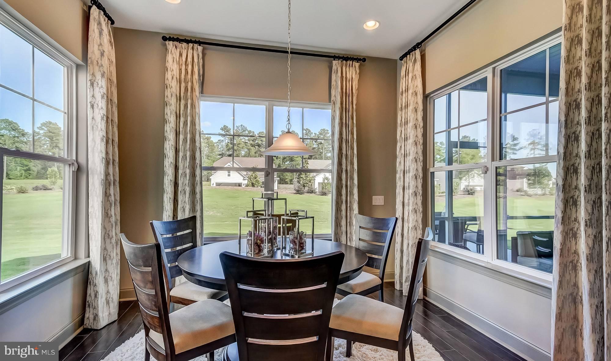19150 Chartres Street Lewes, DE 19958 - Photo 7 of 12 a view of a dining room with furniture window and outside view