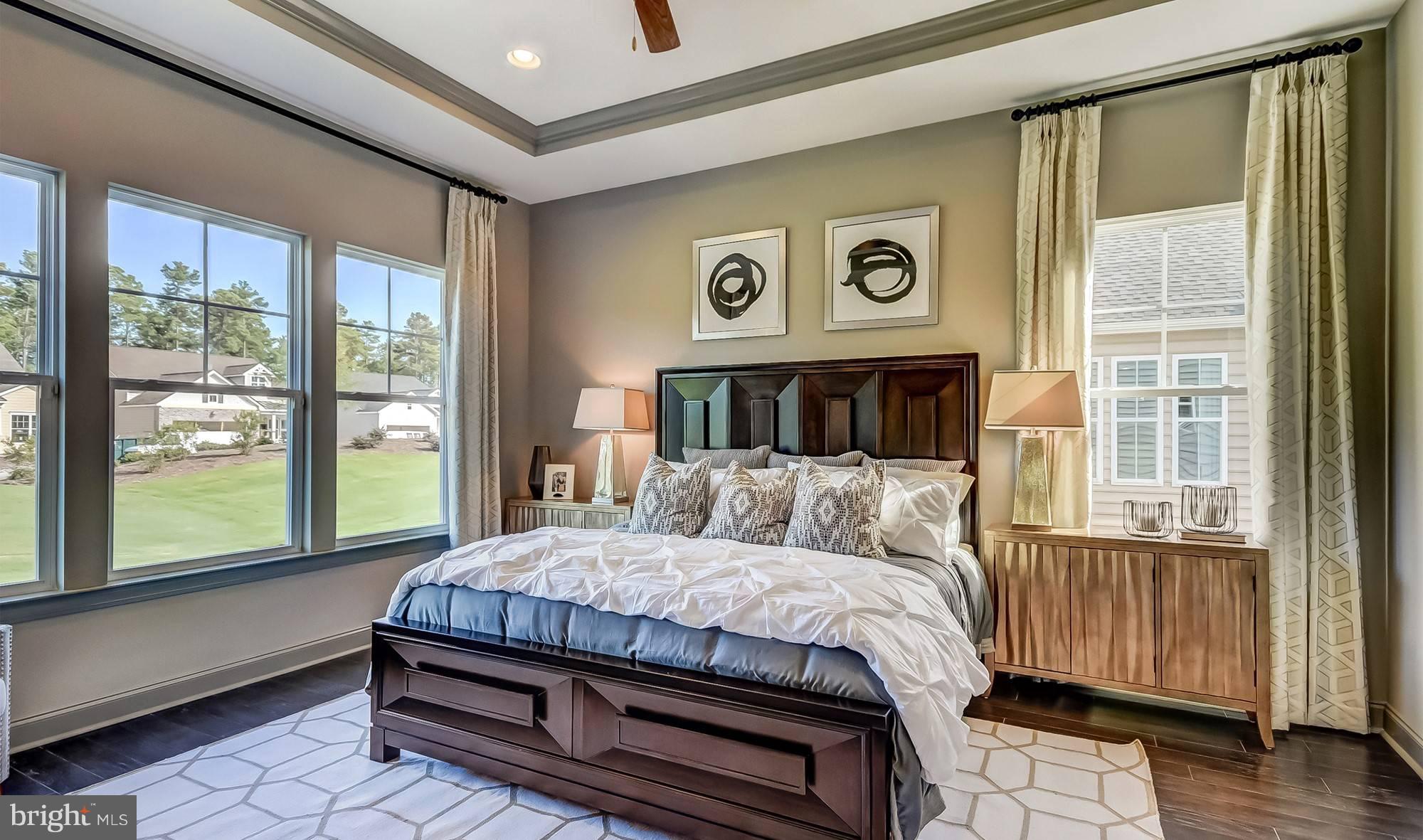 19150 Chartres Street Lewes, DE 19958 - Photo 10 of 12 a bedroom with a bed and a large window with outer view