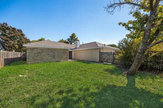 a view of a backyard with a garden and plants
