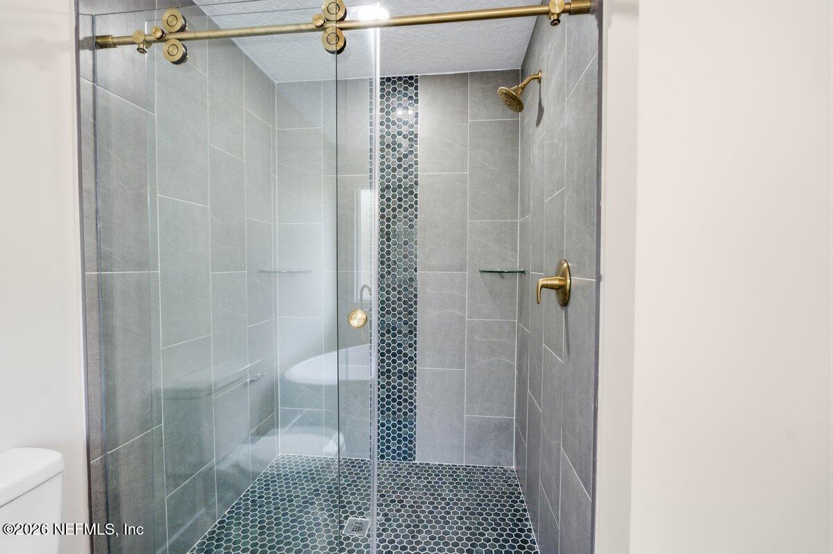6093 Taylor Road Jacksonville, FL 32234 - Photo 19 of 44 a bathroom with a shower