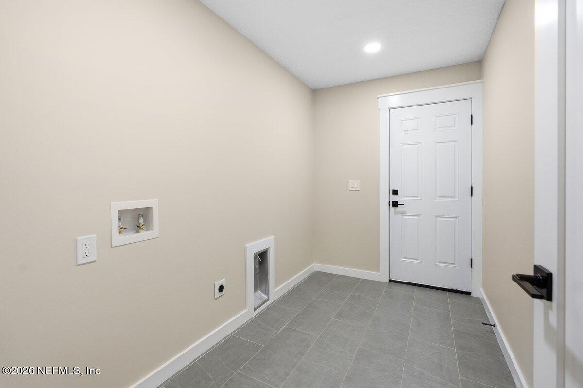 6093 Taylor Road Jacksonville, FL 32234 - Photo 30 of 44 a view of a hallway with closet