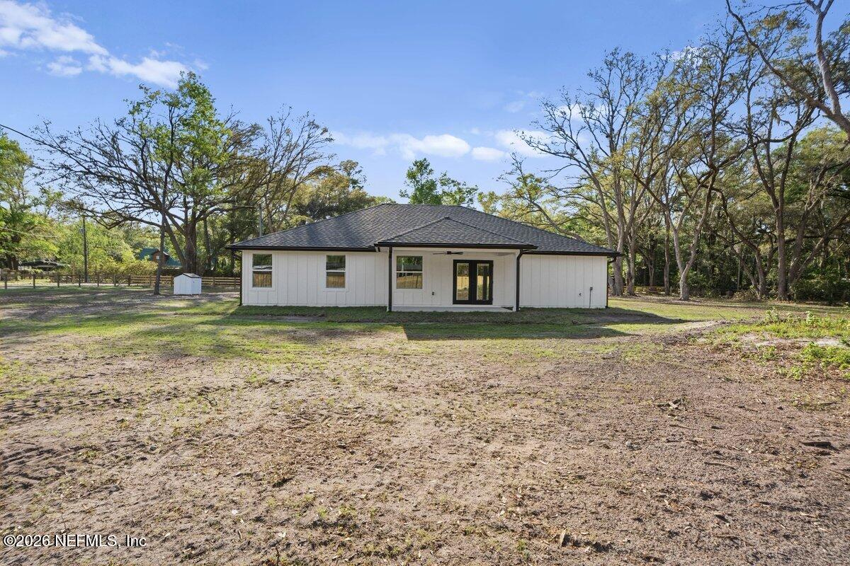 6093 Taylor Road Jacksonville, FL 32234 - Photo 35 of 44 a backyard of a house with lots of green space