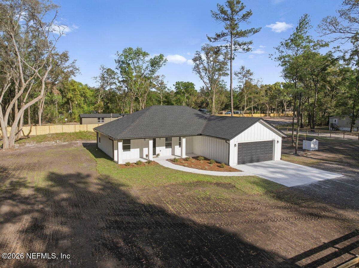 6093 Taylor Road Jacksonville, FL 32234 - Photo 36 of 44 a front view of a house with a yard