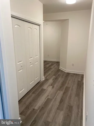 an empty room with wooden floor