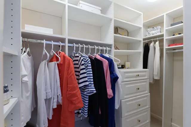 a view of a balcony with potted plants