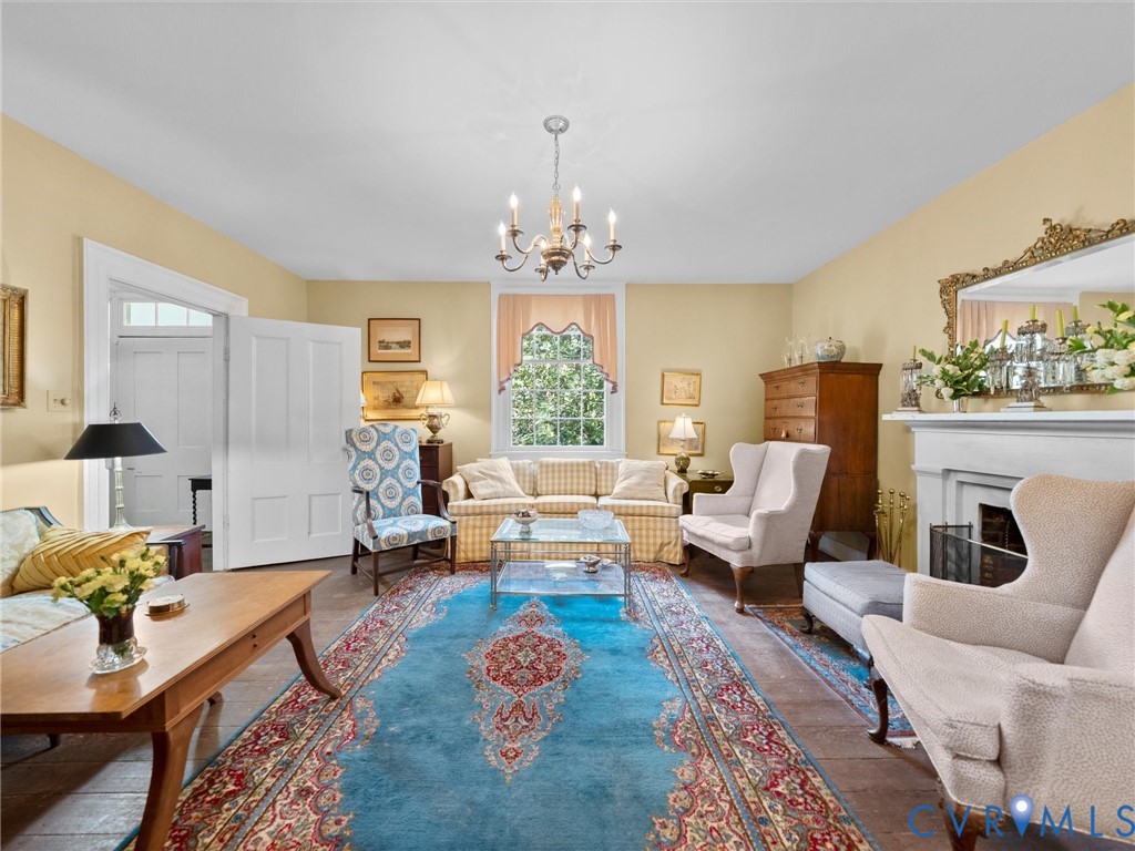 2625 Old Tavern Road Powhatan, VA 23139 - Photo 12 of 100 a living room with furniture or couch and a chandelier