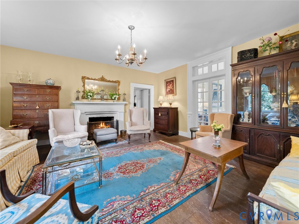 2625 Old Tavern Road Powhatan, VA 23139 - Photo 13 of 100 a living room with furniture a fireplace and a table