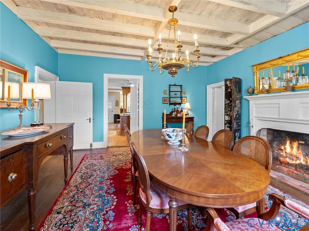2625 Old Tavern Road Powhatan, VA 23139 - Photo 16 of 100 a view of a dining room with furniture a chandelier and kitchen view