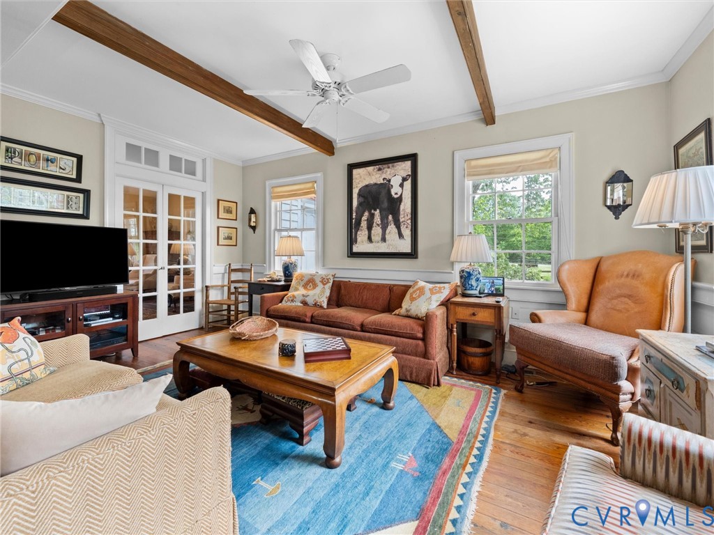2625 Old Tavern Road Powhatan, VA 23139 - Photo 19 of 100 a living room with furniture a flat screen tv and a large window