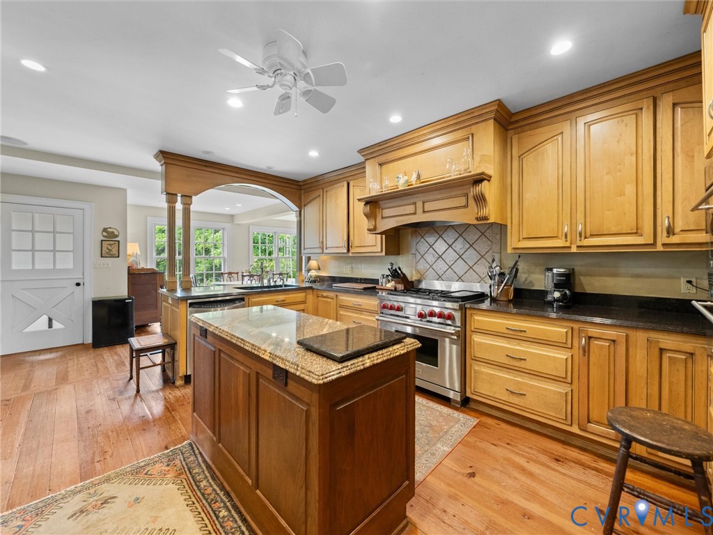 2625 Old Tavern Road Powhatan, VA 23139 - Photo 27 of 100 a kitchen with stainless steel appliances granite countertop a stove a sink dishwasher and a refrigerator with white cabinets