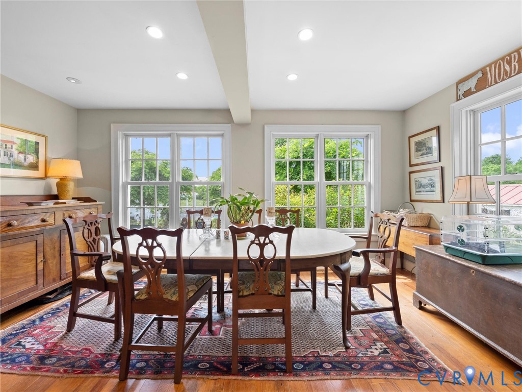 2625 Old Tavern Road Powhatan, VA 23139 - Photo 33 of 100 a view of a dining room with furniture a rug and wooden floor