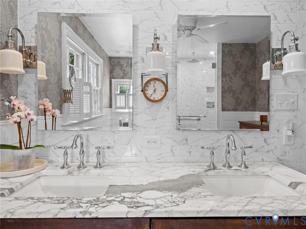 2625 Old Tavern Road Powhatan, VA 23139 - Photo 38 of 100 a bathroom with a granite countertop sink a mirror and shower
