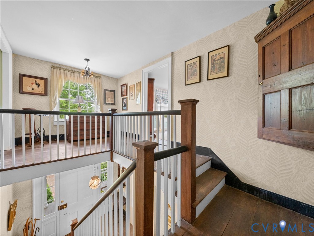 2625 Old Tavern Road Powhatan, VA 23139 - Photo 48 of 100 a view of staircase with lots of frames on wall and a window