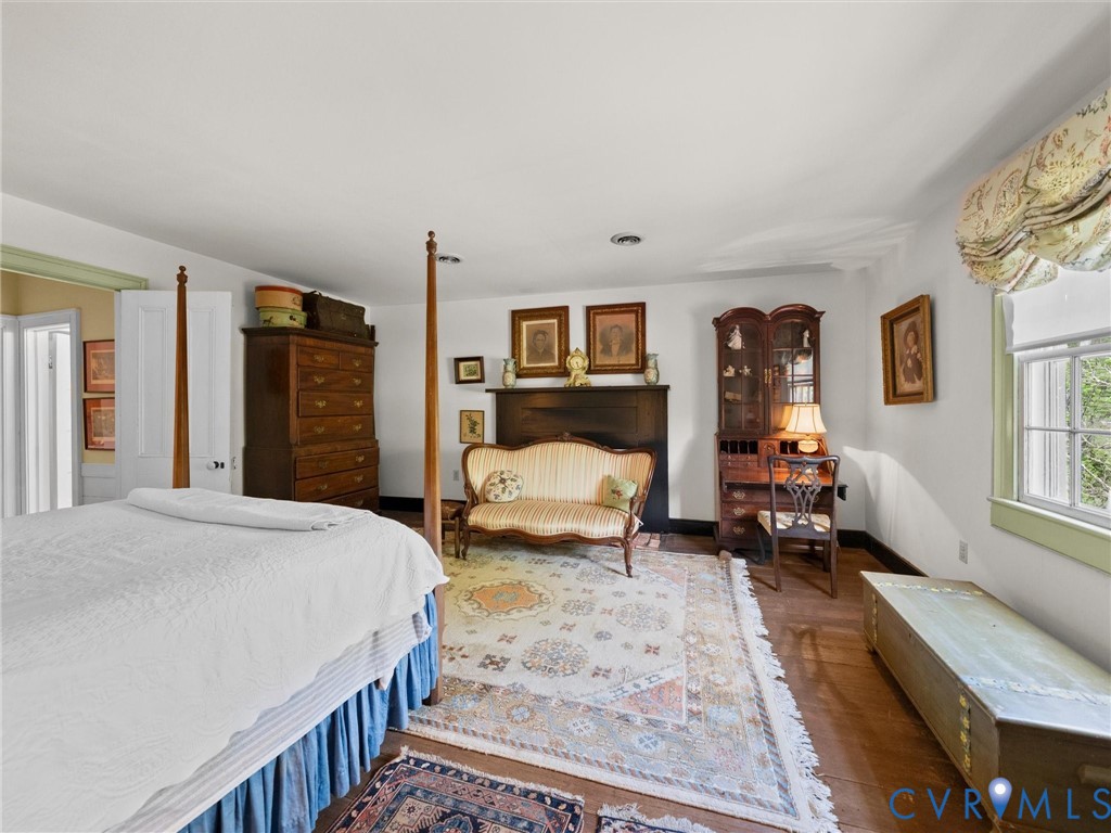 2625 Old Tavern Road Powhatan, VA 23139 - Photo 51 of 100 a bedroom with a large bed couch and a window