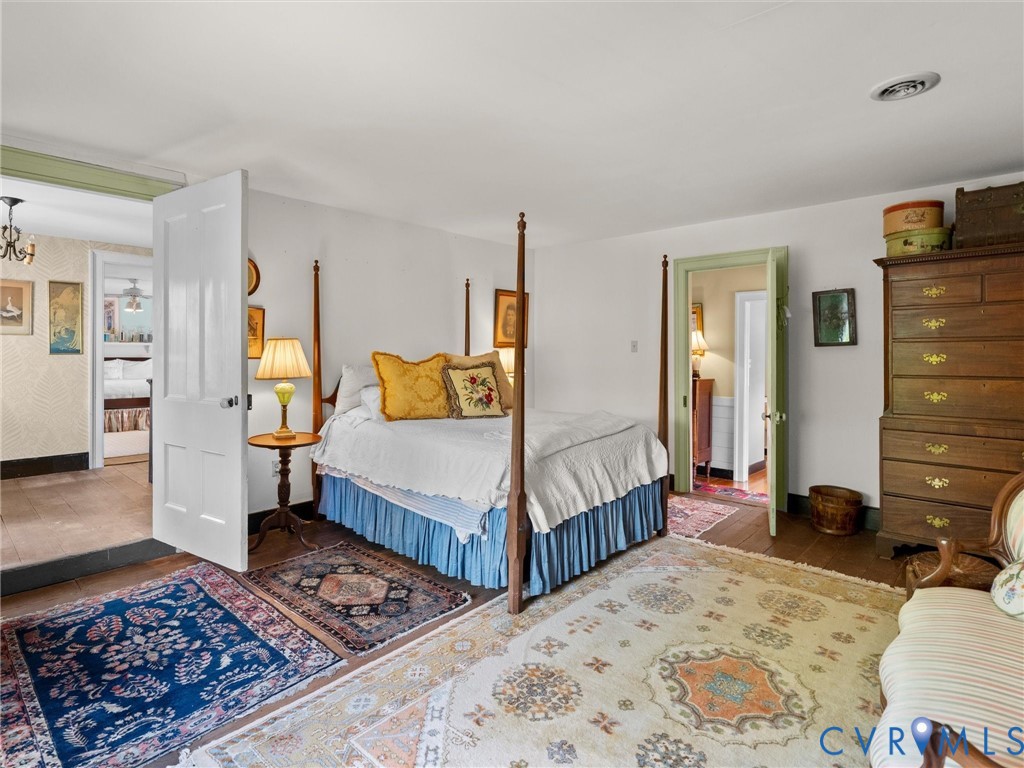 2625 Old Tavern Road Powhatan, VA 23139 - Photo 52 of 100 a bedroom with a bed and wooden floor