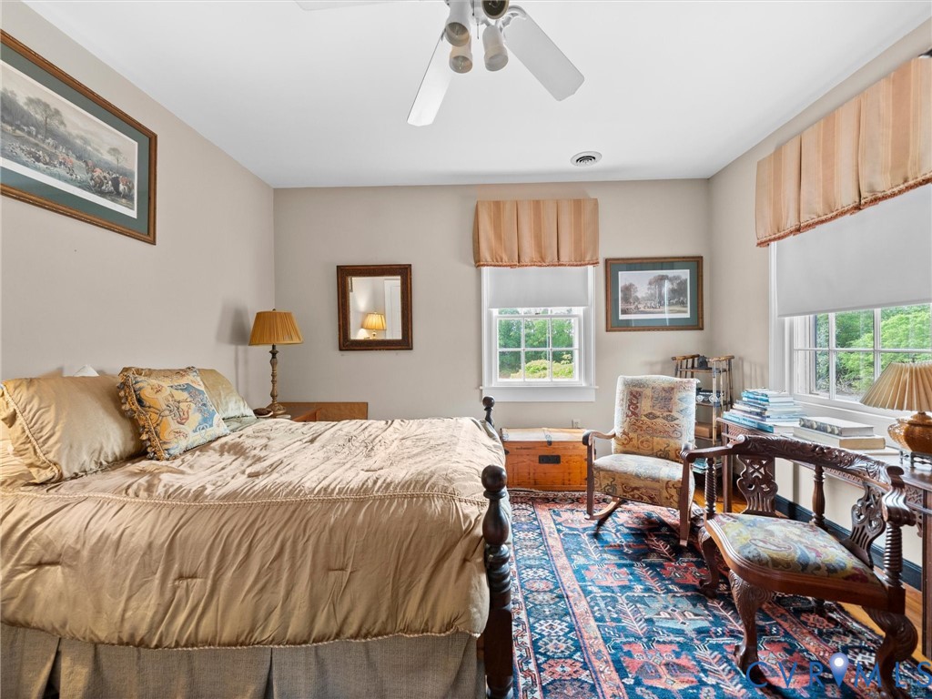 2625 Old Tavern Road Powhatan, VA 23139 - Photo 54 of 100 a bed room with a bed and a chair