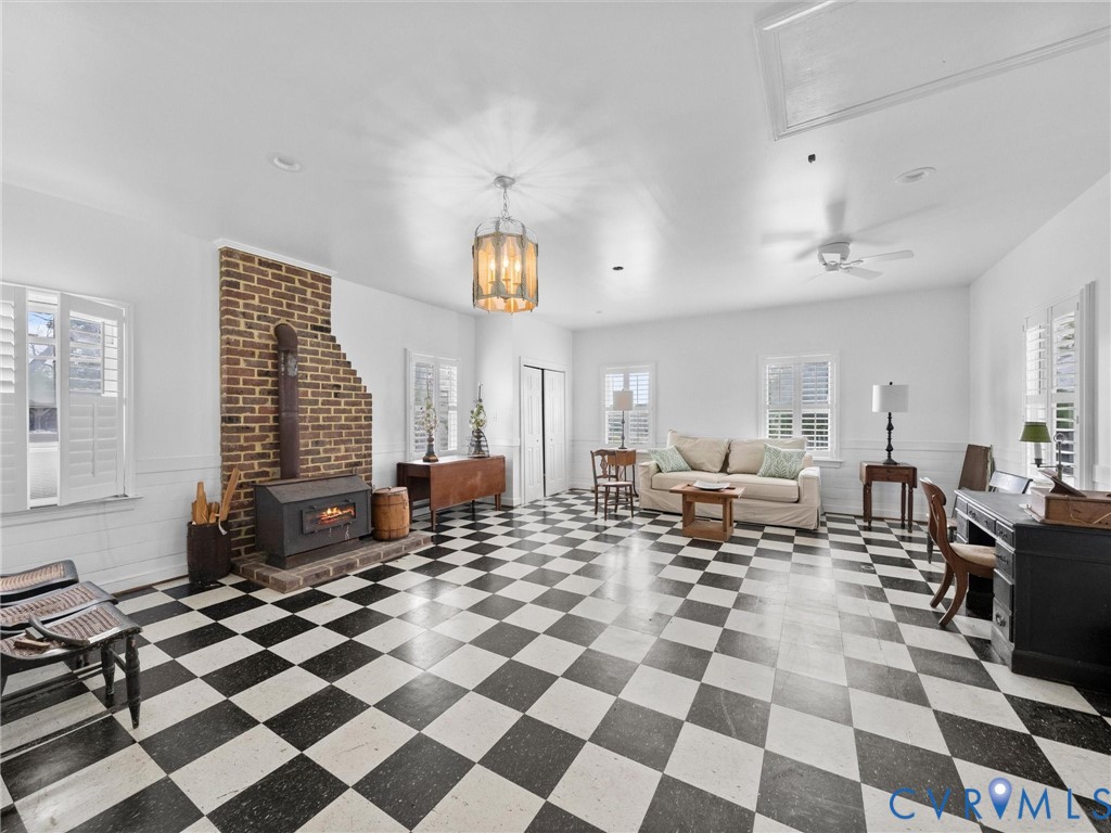 2625 Old Tavern Road Powhatan, VA 23139 - Photo 68 of 100 a living room with a black white checkered floor with couches chair and a coffee table